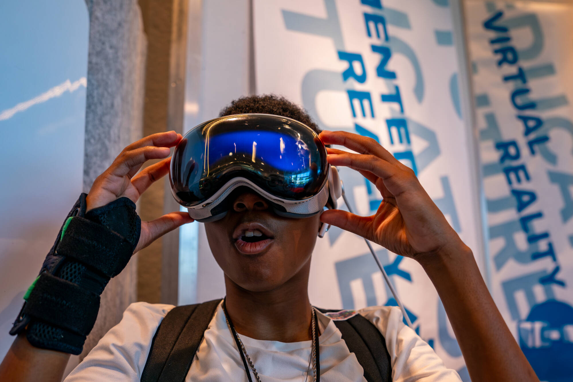 Taryia Collins uses virtual reality goggles at the Atomic Object Technology Showcase inside the Mary Idema Pew Library as part of College Prep Week on the Allendale Campus on July 15. Taryia is a graduate of University Prep Science and Math High School.